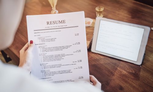 woman holding resume application with using tablet digital to jo